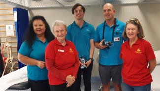 Auxiliary members Mollie and Kay handing over the patient pulse oximeters to BCH physio team